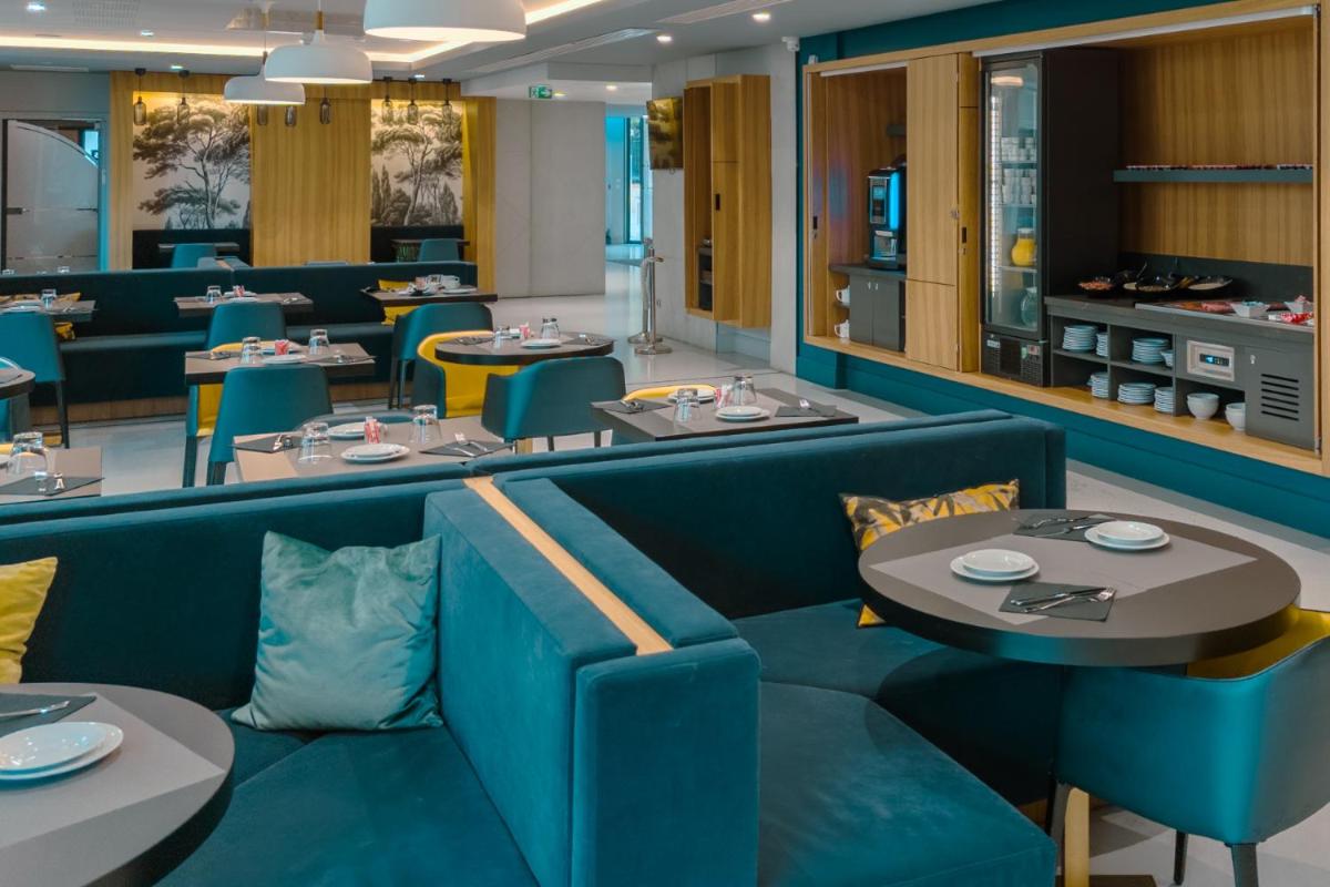 Coin salon dans l'établissement Nemea Appart Hotel Cannes Palais