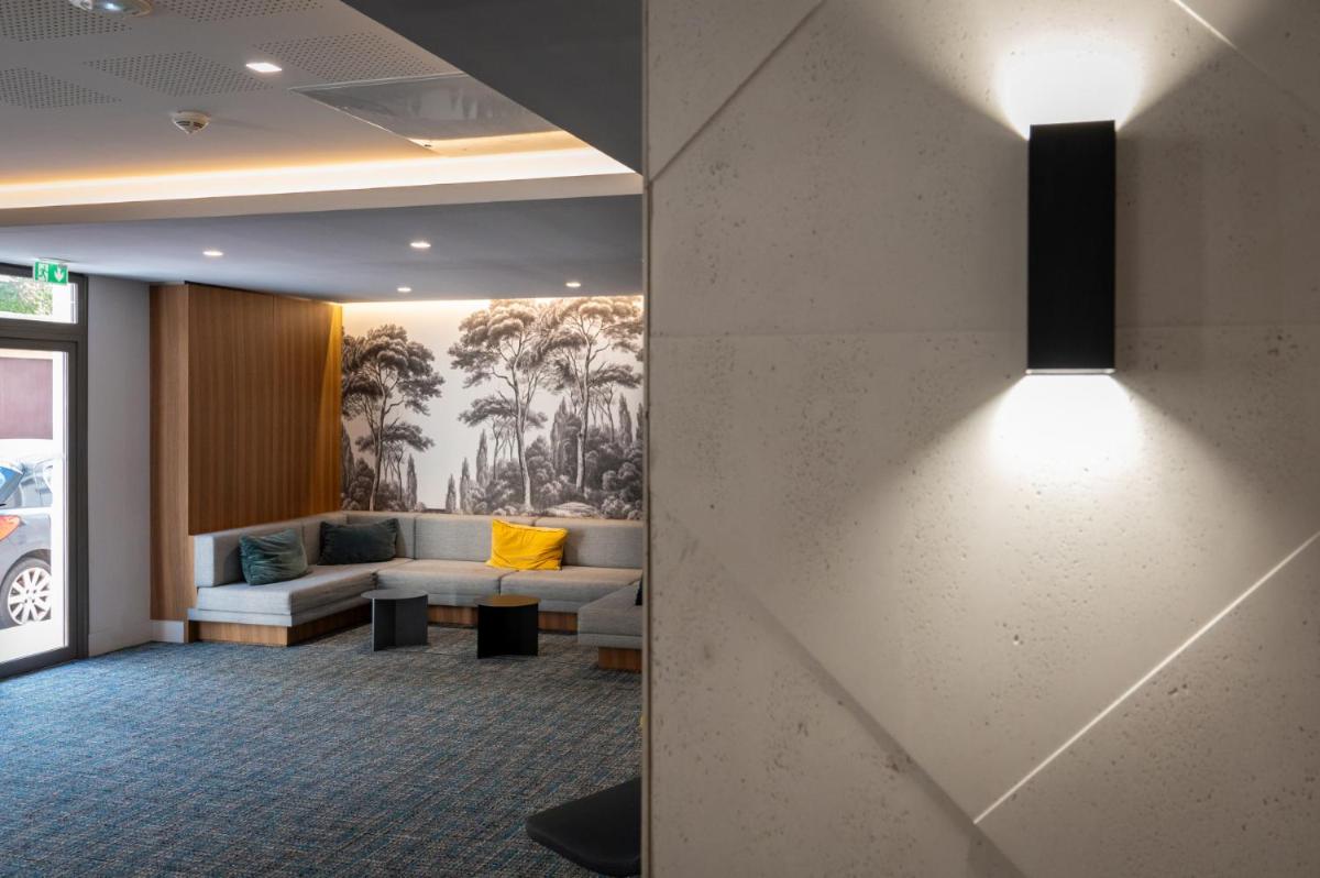 Coin salon dans l'établissement Nemea Appart Hotel Cannes Palais