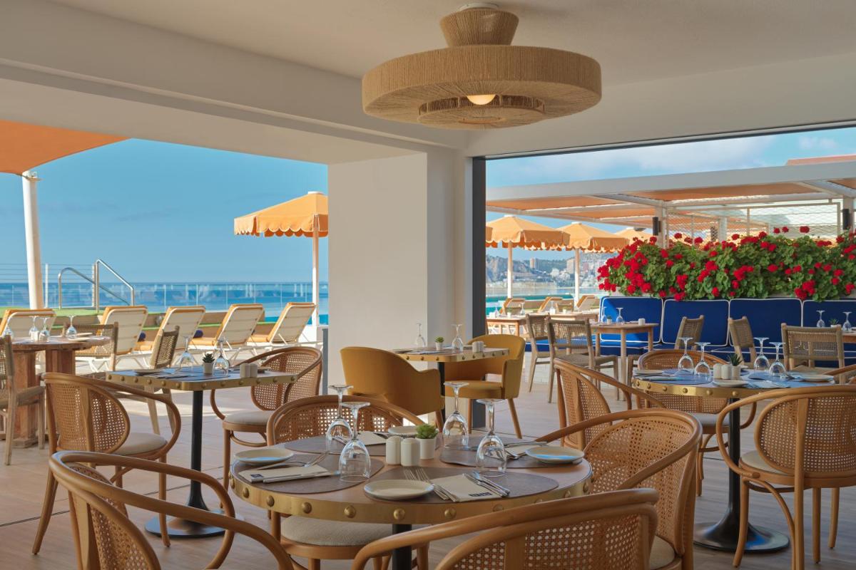 Un restaurante o sitio para comer en H10 Porto Poniente 4* Sup