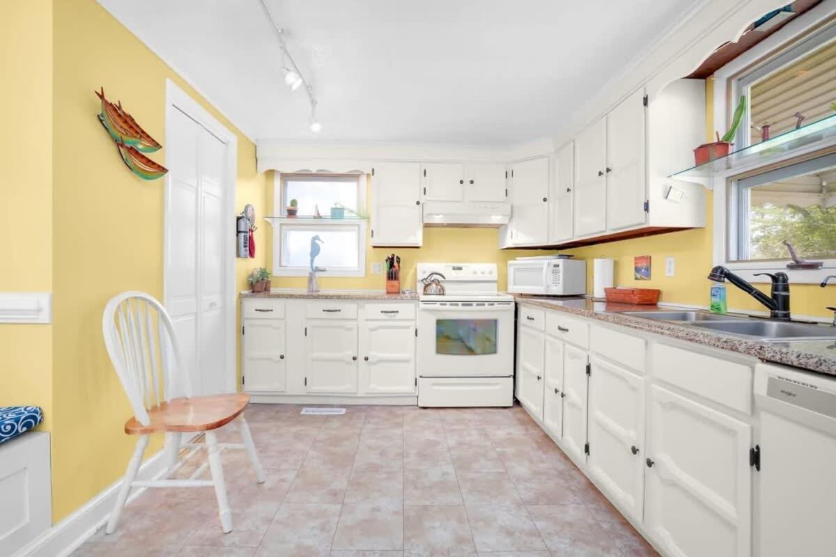 Cottage w Private Creek, Sunroom, Fire Pit, & WiFi - Housity