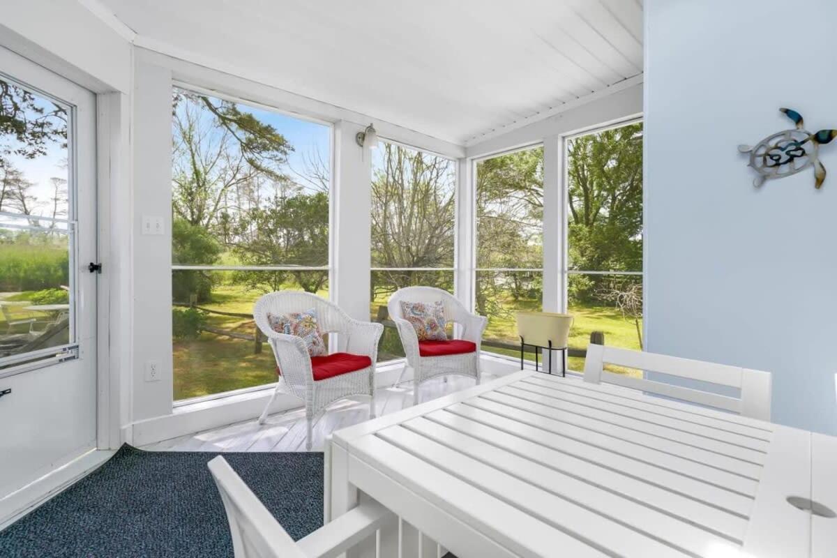 Cottage w Private Creek, Sunroom, Fire Pit, & WiFi - Housity
