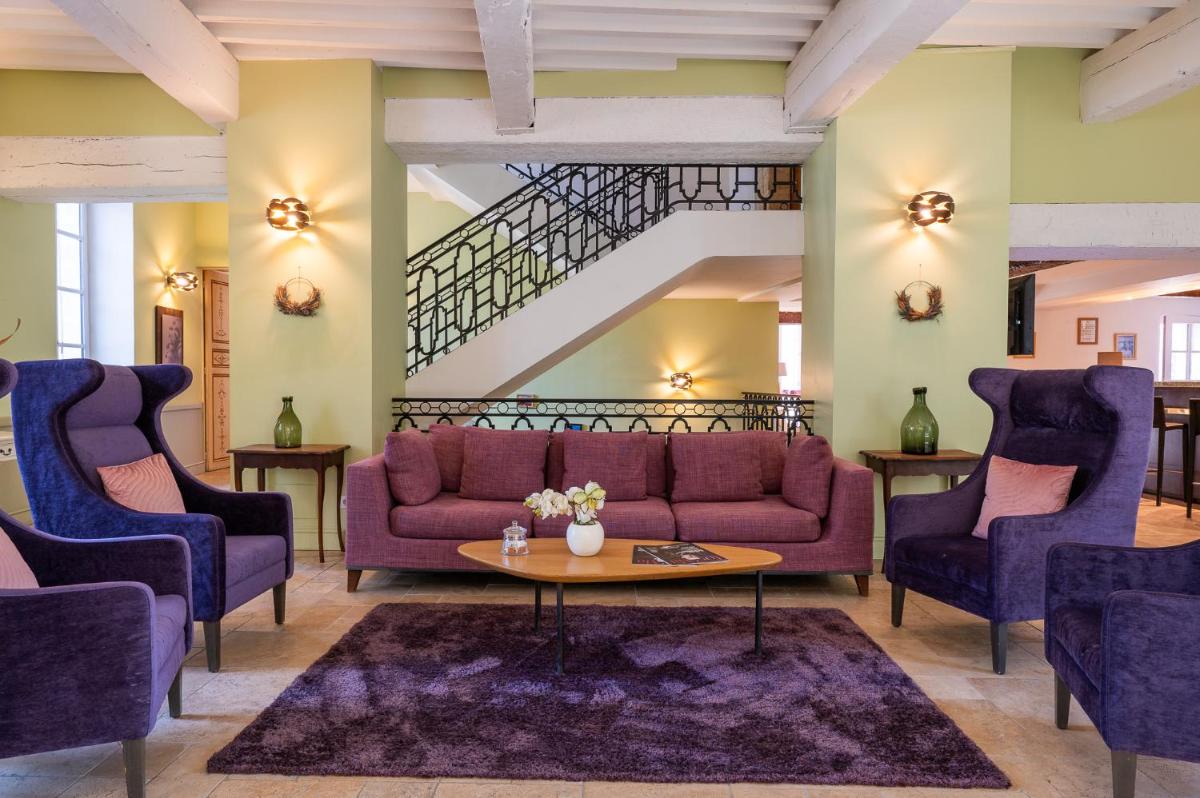 Coin salon dans l'établissement Moulin de Vernègues Hôtel & Spa