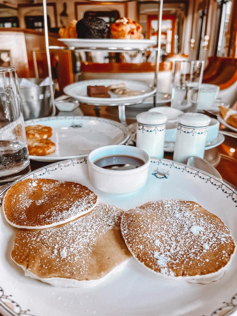 two pancakes on a white plate on a table at The Raj Palace (Small Luxury Hotels of the World) in Jaipur