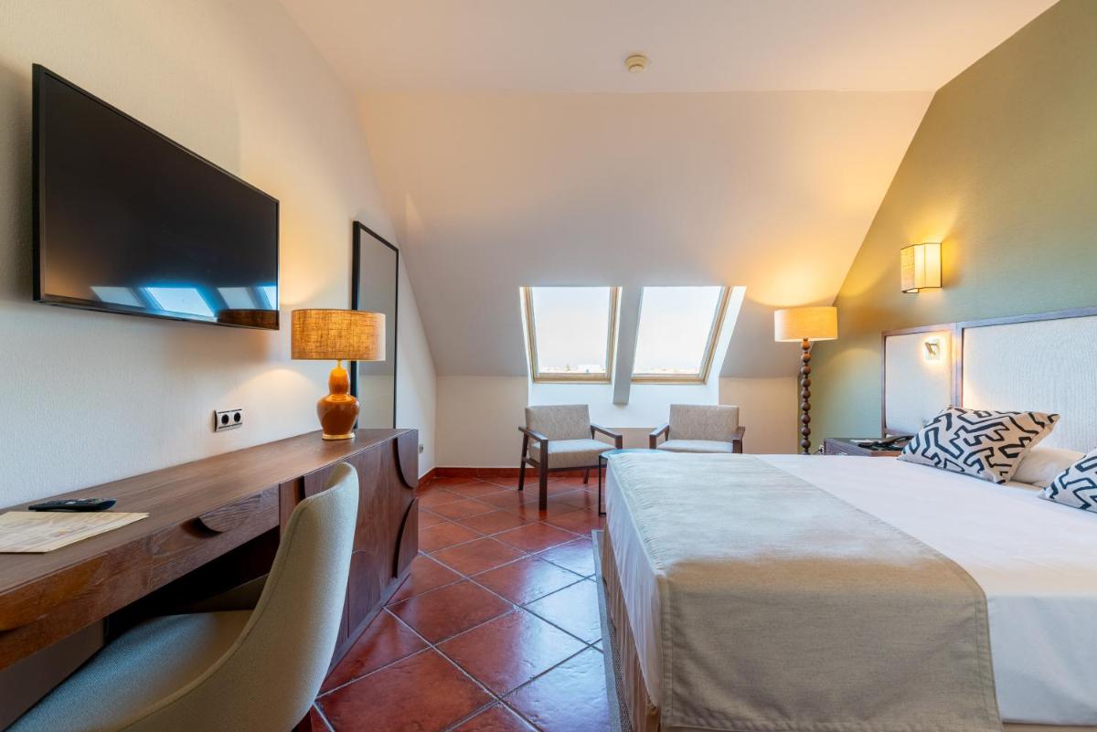 Cama o camas de una habitación en Puerto Antilla Grand Hotel