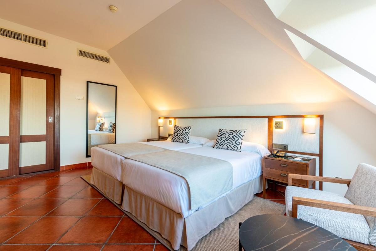 Cama o camas de una habitación en Puerto Antilla Grand Hotel