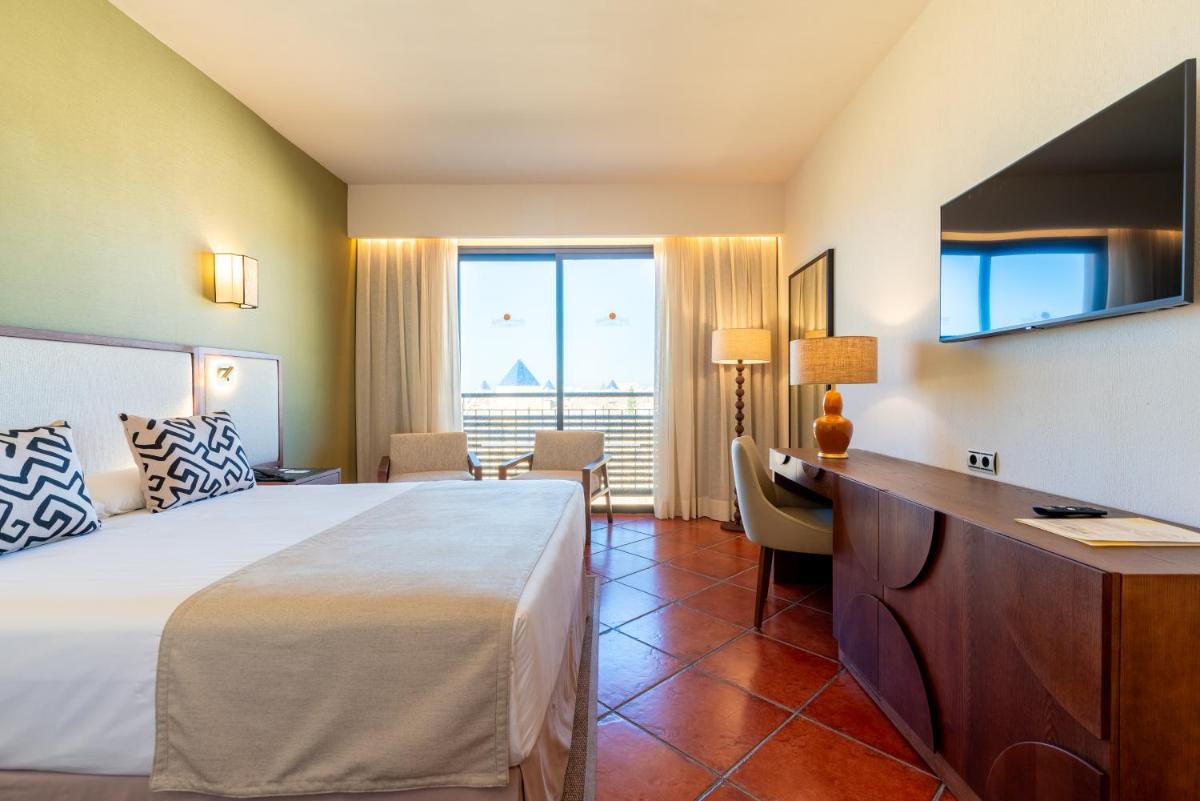 Cama o camas de una habitación en Puerto Antilla Grand Hotel
