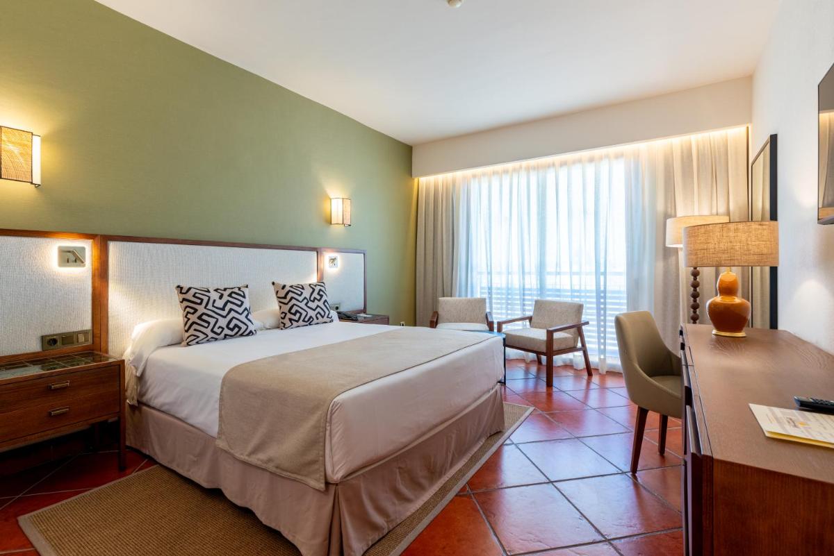 Cama o camas de una habitación en Puerto Antilla Grand Hotel