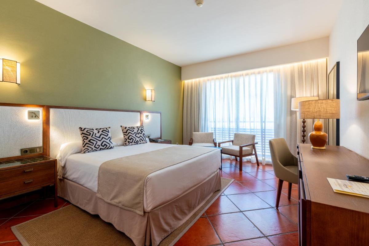Cama o camas de una habitación en Puerto Antilla Grand Hotel