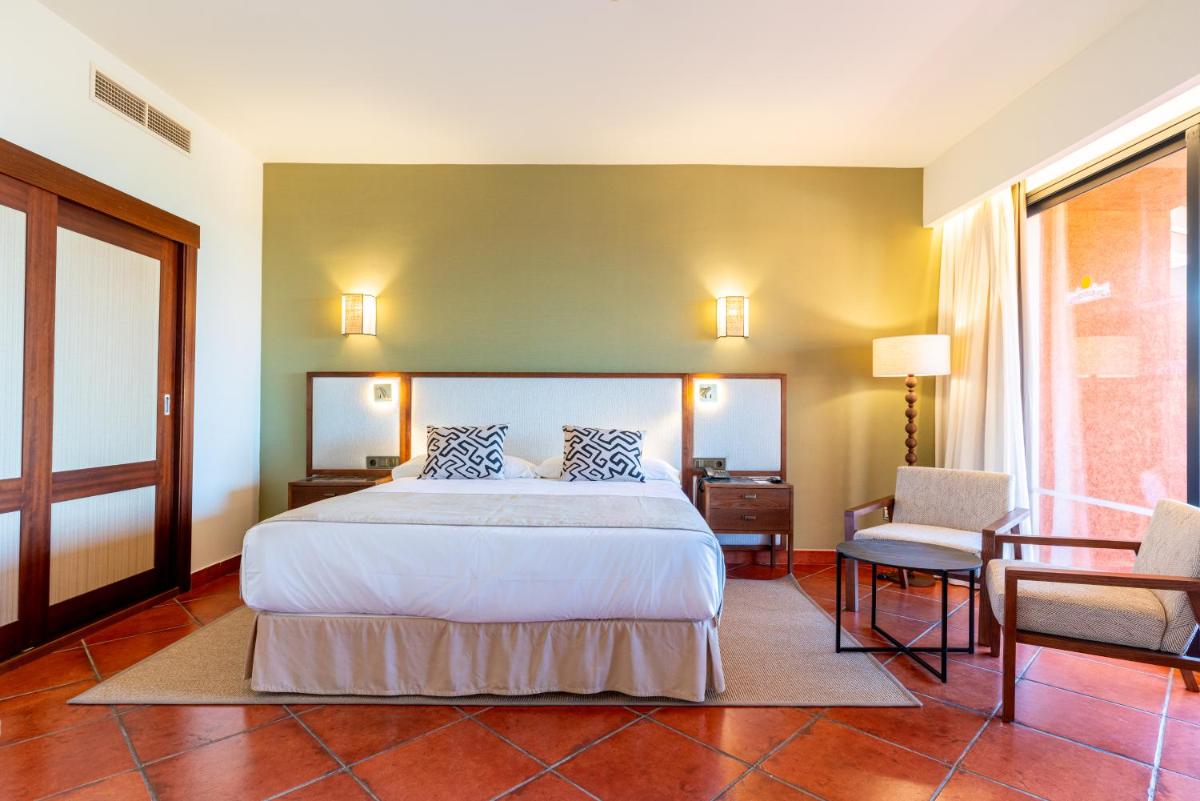 Cama o camas de una habitación en Puerto Antilla Grand Hotel