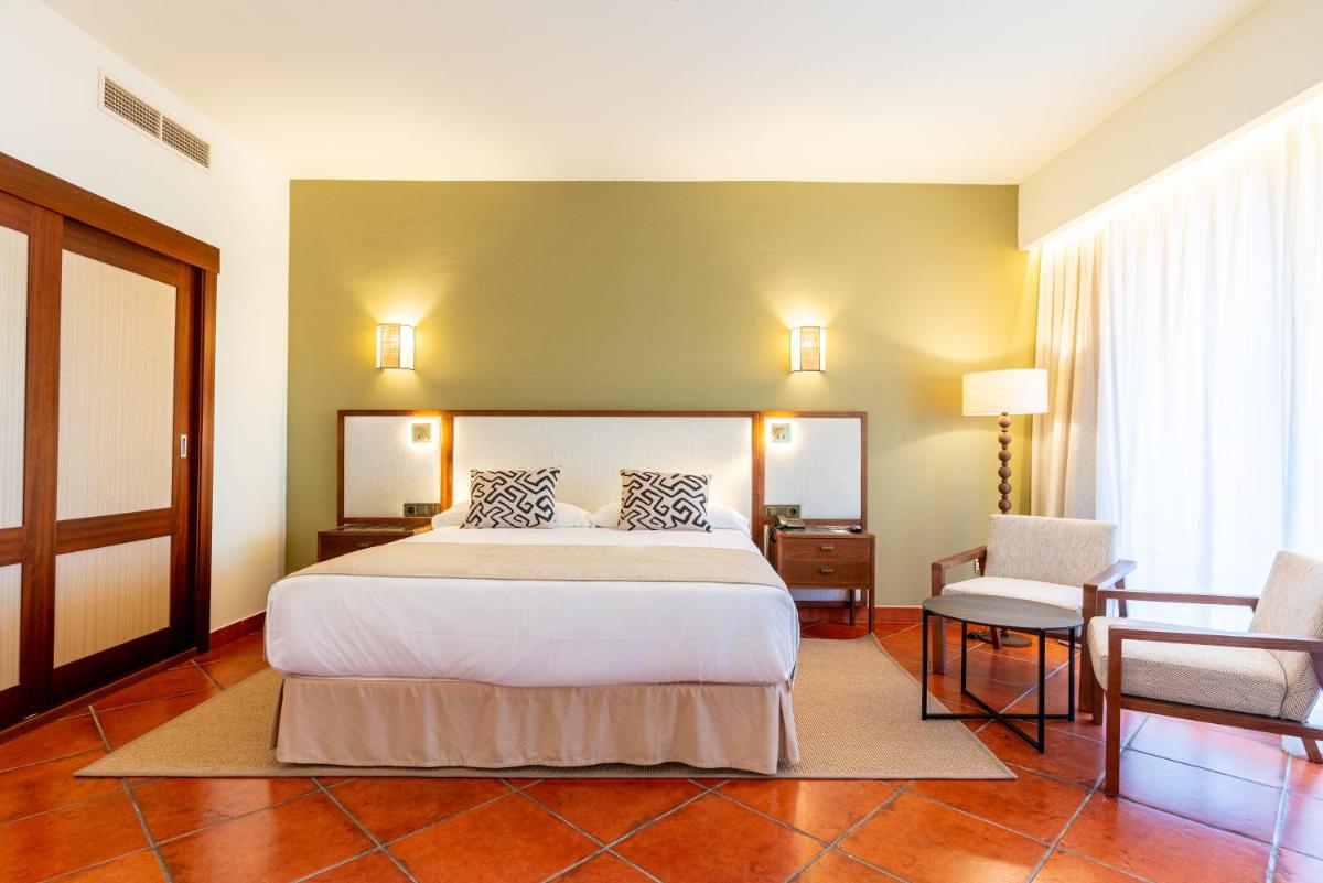 Cama o camas de una habitación en Puerto Antilla Grand Hotel