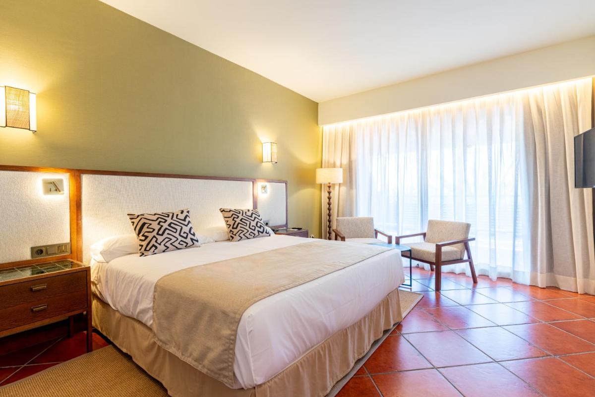Cama o camas de una habitación en Puerto Antilla Grand Hotel