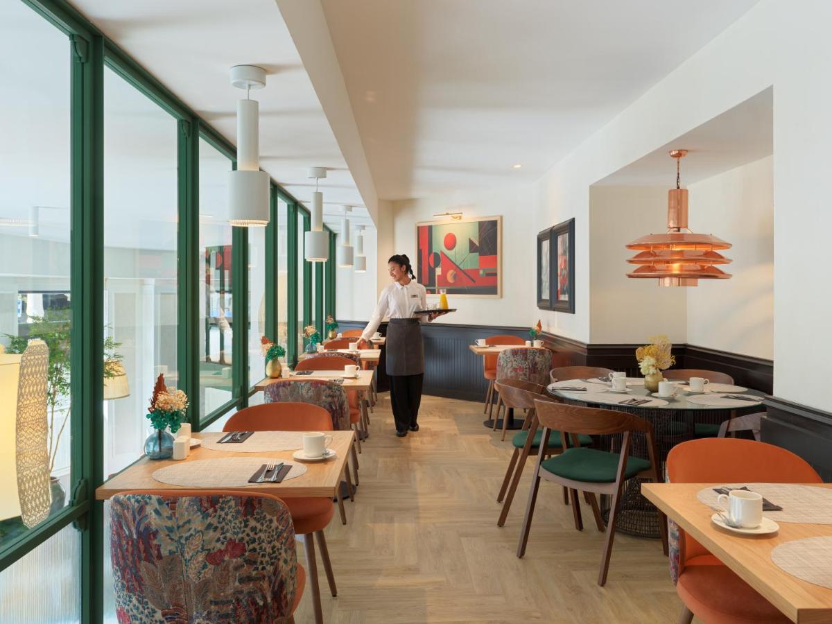Un restaurante o sitio para comer en H10 Casanova