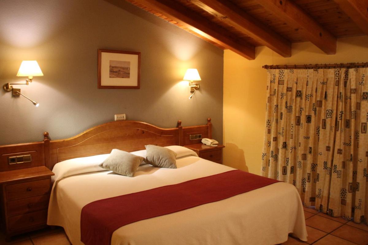 Cama o camas de una habitación en Hotel & SPA Peña Montañesa