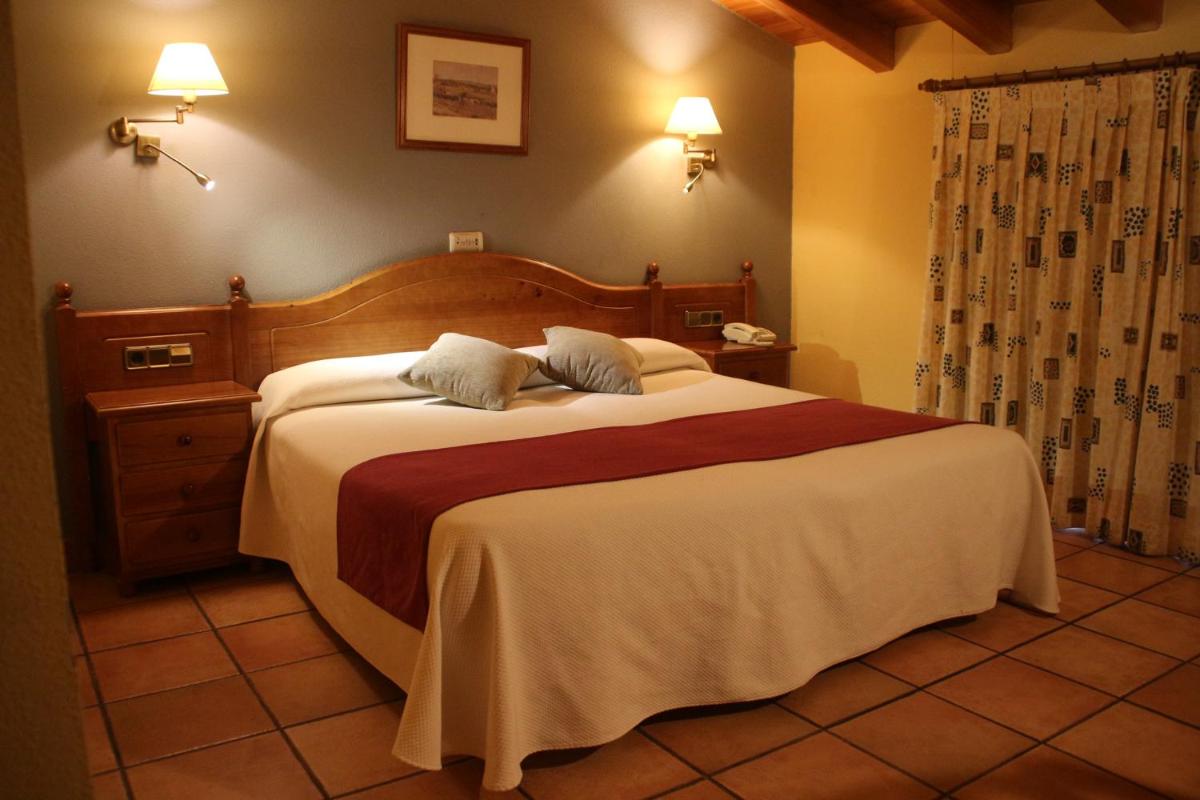 Cama o camas de una habitación en Hotel & SPA Peña Montañesa