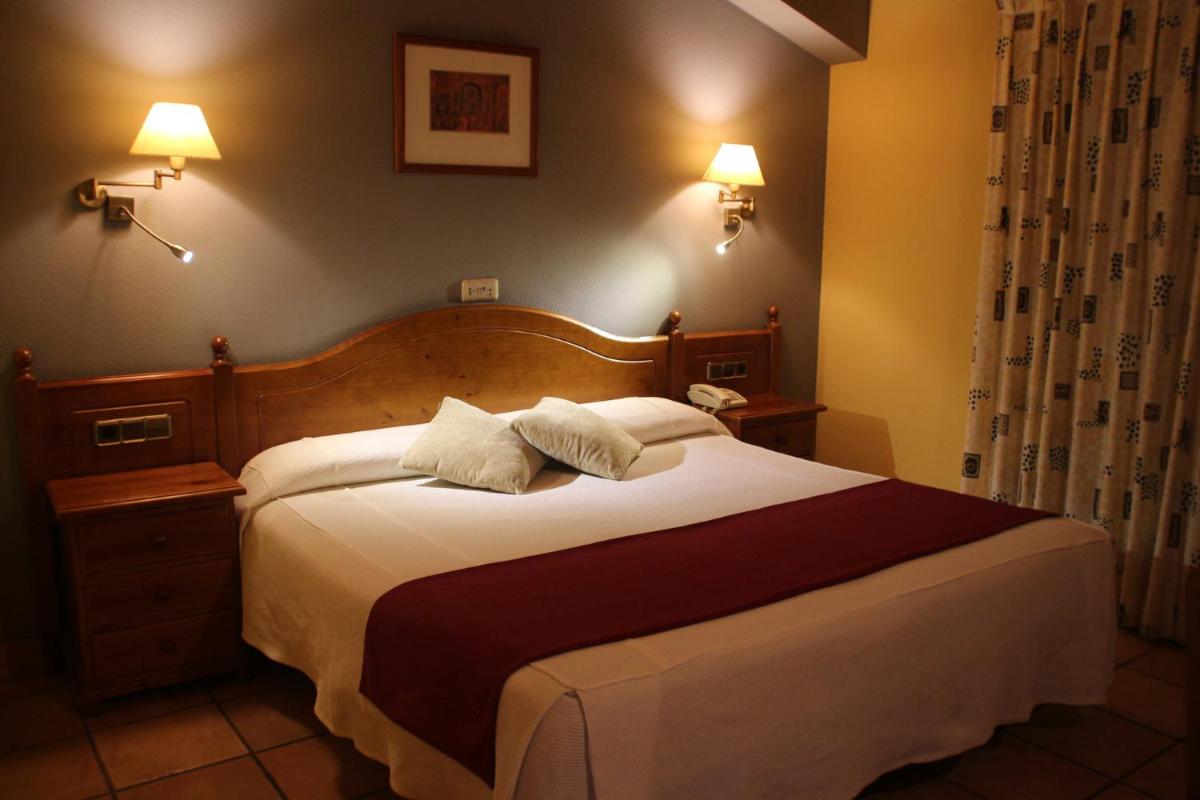 Cama o camas de una habitación en Hotel & SPA Peña Montañesa