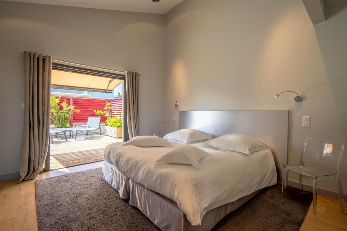 Un ou plusieurs lits dans un hébergement de l'établissement Lafitenia Resort