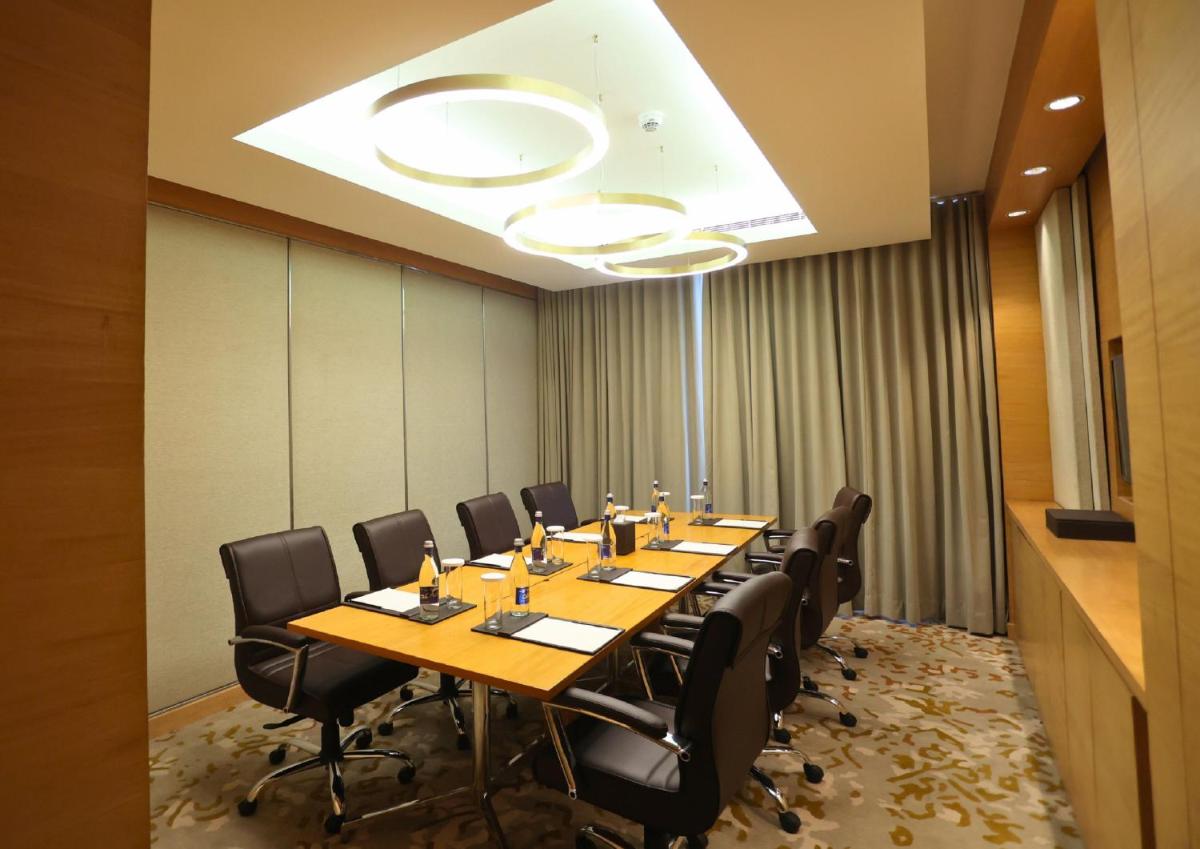 a conference room with a long table and chairs at InterContinental Jaipur Tonk Road by IHG in Jaipur