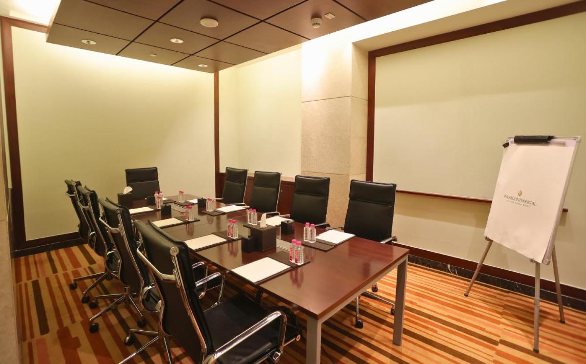a meeting room with a long table and chairs at InterContinental Jaipur Tonk Road by IHG in Jaipur