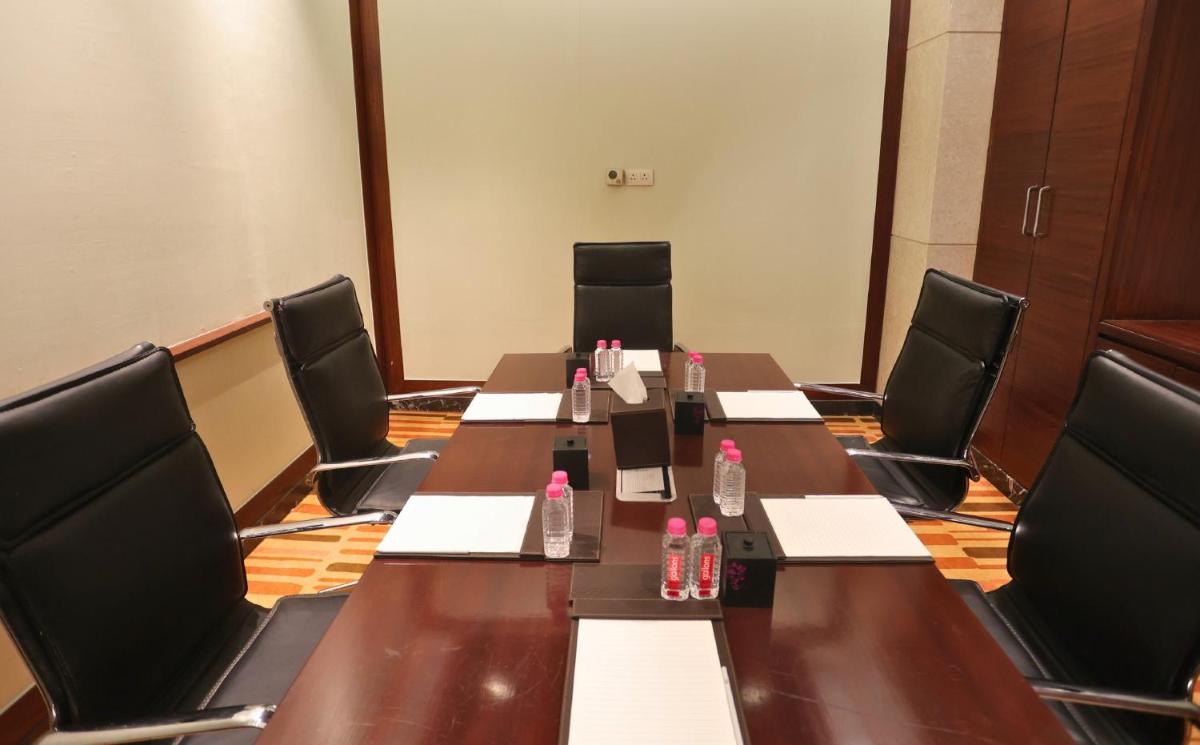 a conference room with a long table and chairs at InterContinental Jaipur Tonk Road by IHG in Jaipur