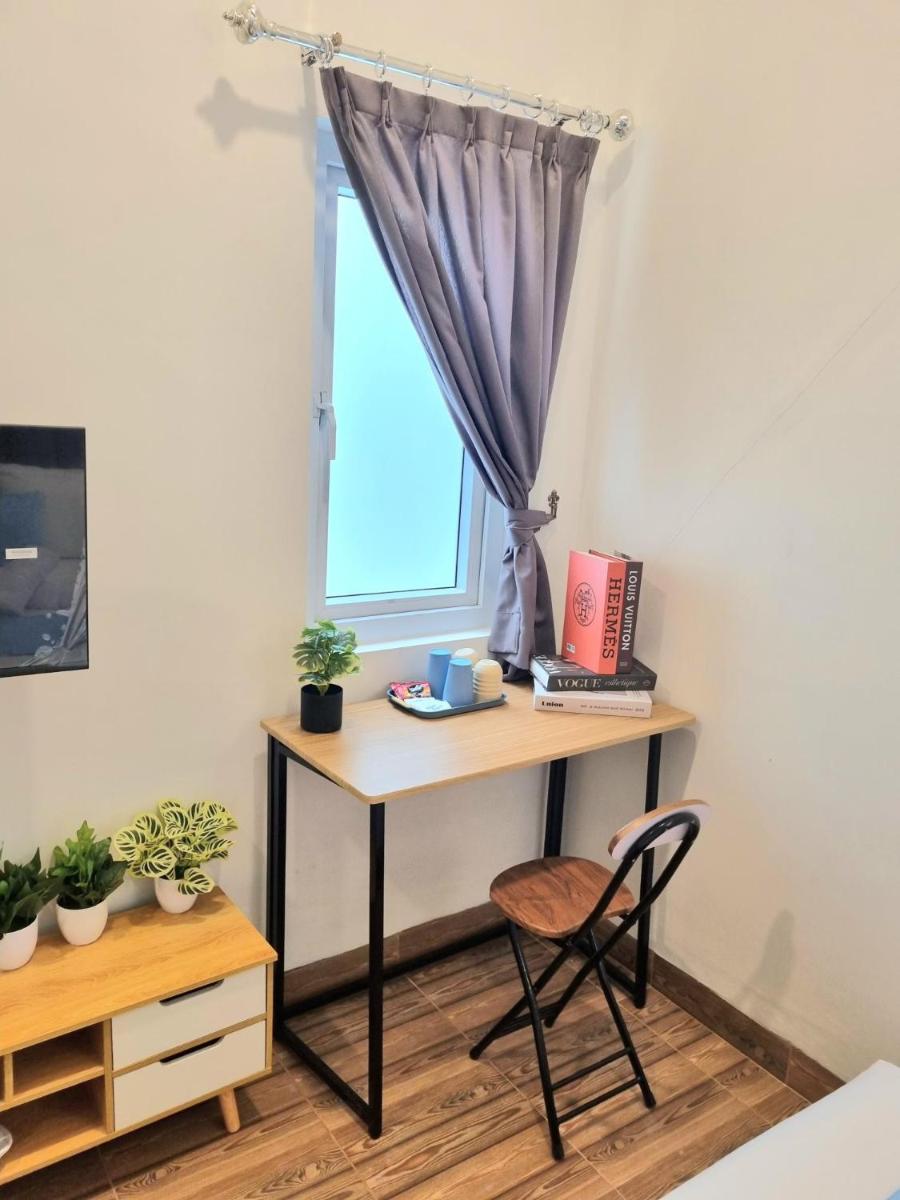 Zizi Homey Cemara Asri Triple Room 202 - Housity