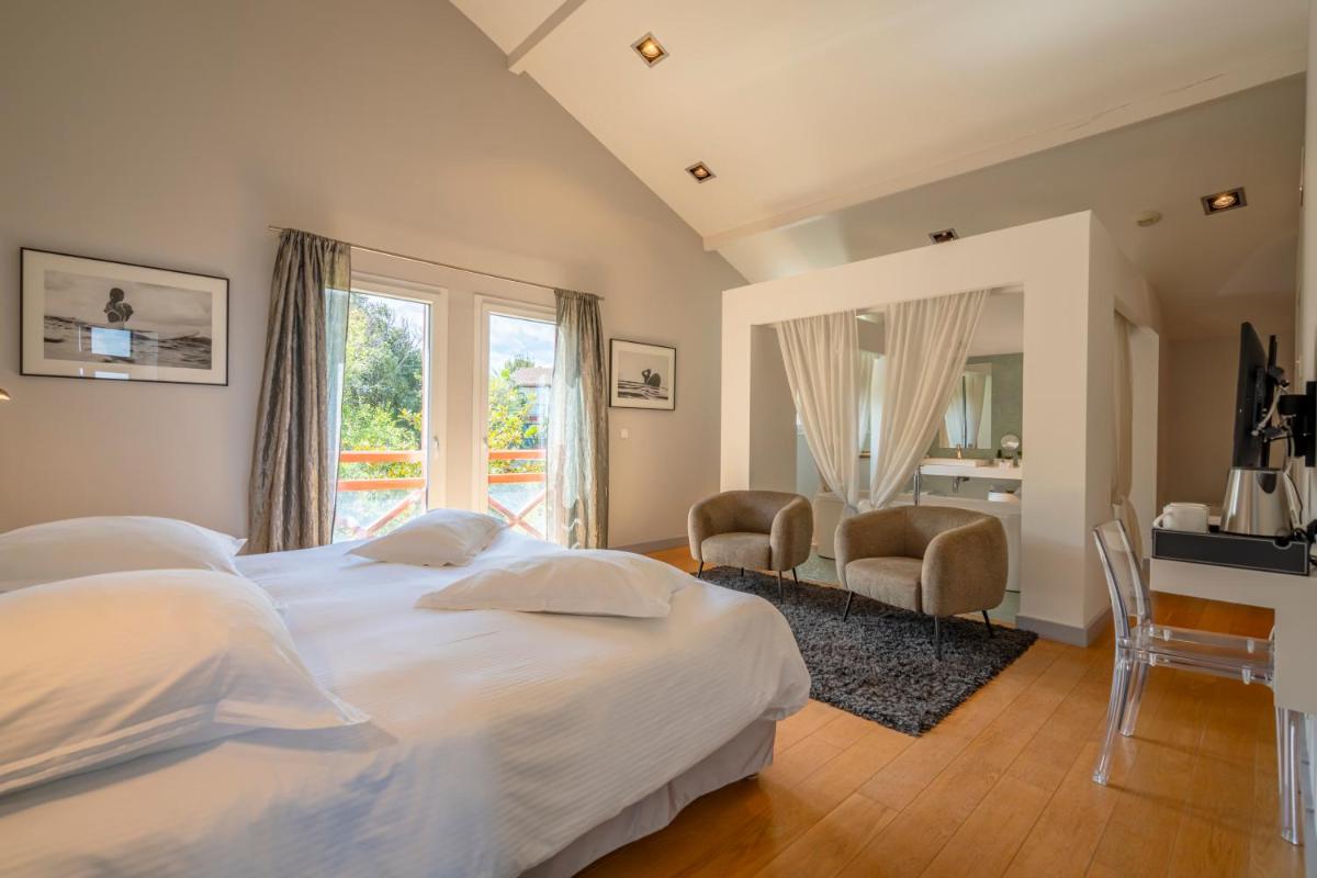 Un ou plusieurs lits dans un hébergement de l'établissement Lafitenia Resort