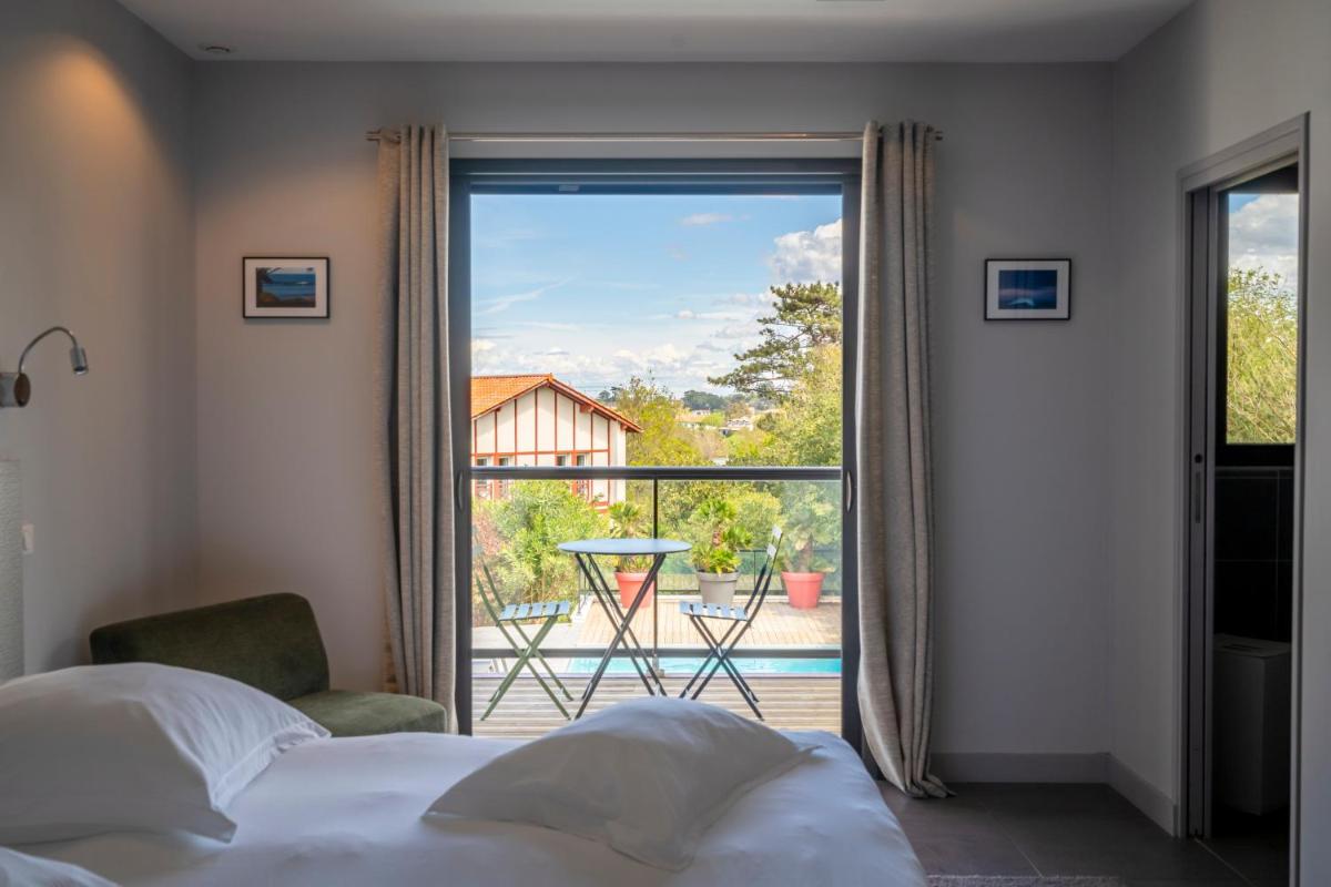 Un ou plusieurs lits dans un hébergement de l'établissement Lafitenia Resort
