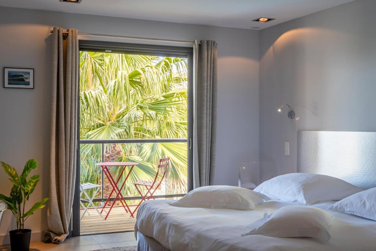 Un ou plusieurs lits dans un hébergement de l'établissement Lafitenia Resort