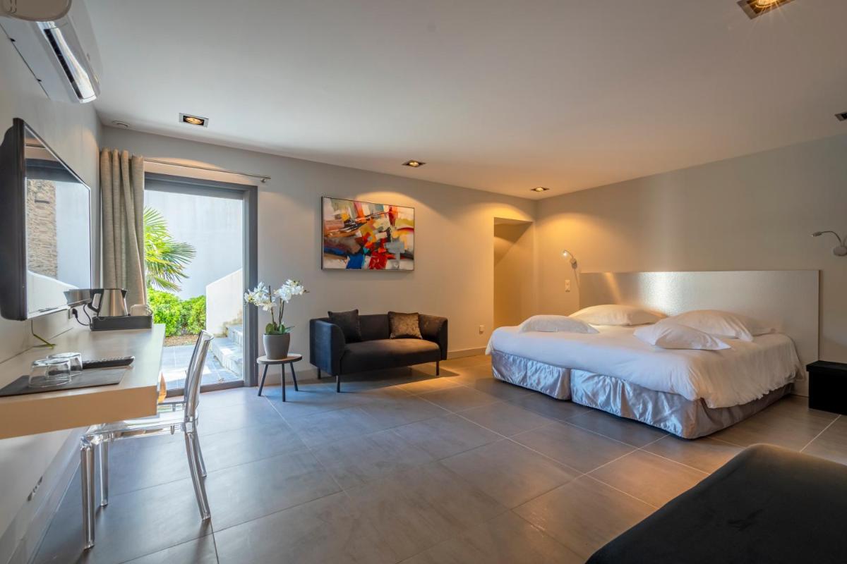 Un ou plusieurs lits dans un hébergement de l'établissement Lafitenia Resort