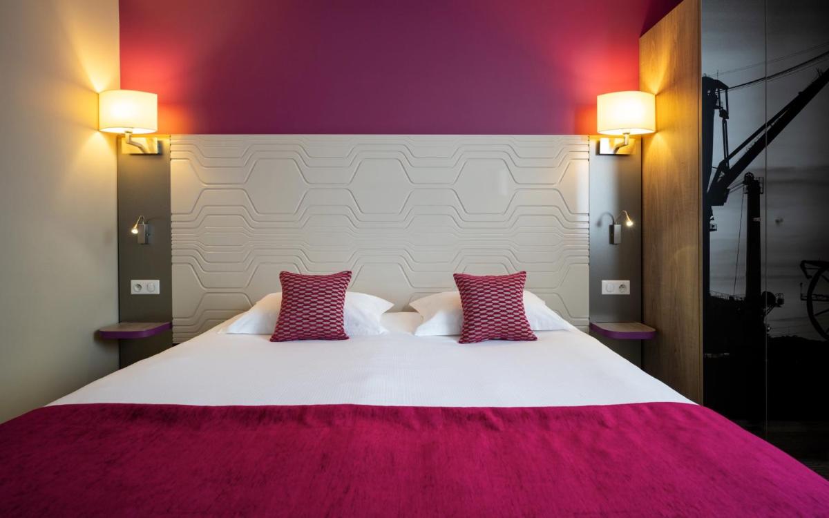 Un ou plusieurs lits dans un hébergement de l'établissement Kyriad Prestige Saint-Malo