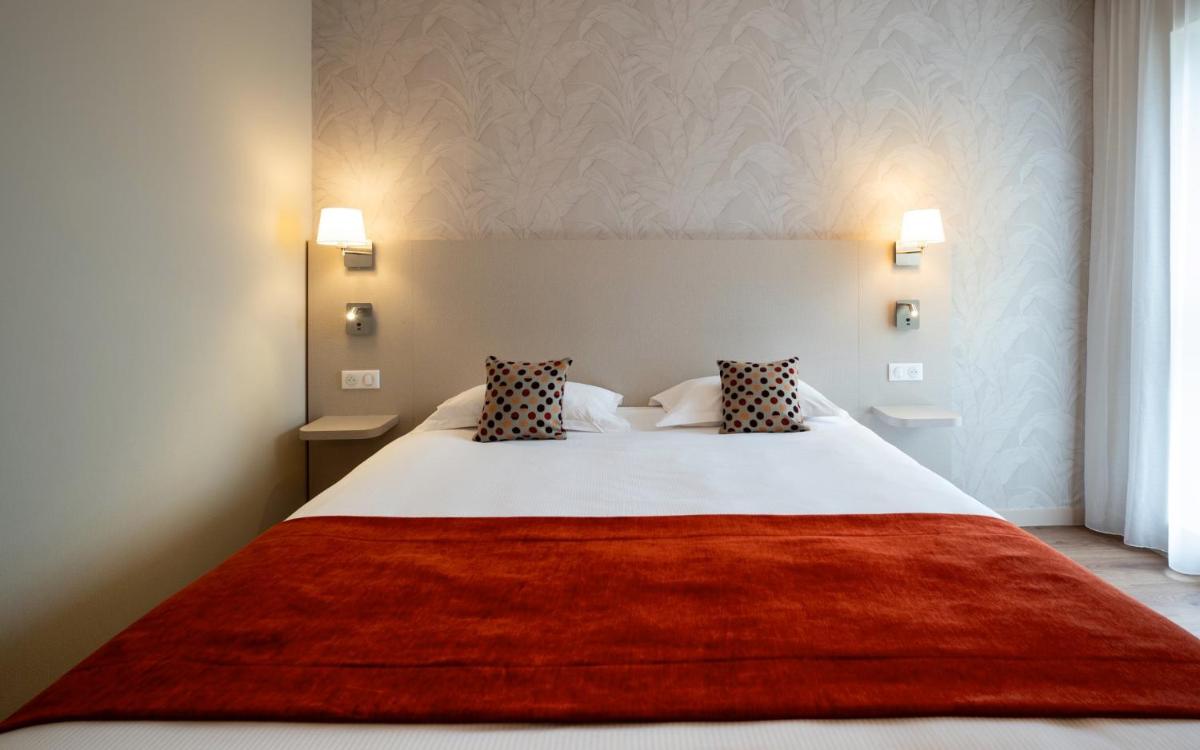 Un ou plusieurs lits dans un hébergement de l'établissement Kyriad Prestige Saint-Malo