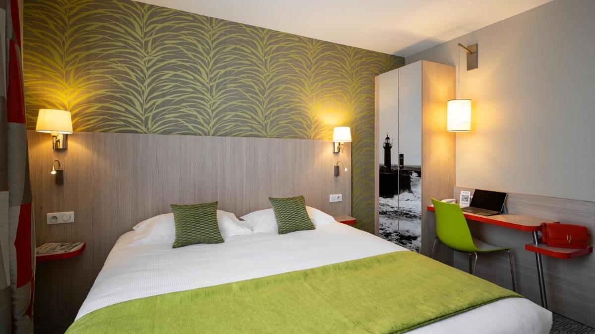 Un ou plusieurs lits dans un hébergement de l'établissement Kyriad Prestige Saint-Malo