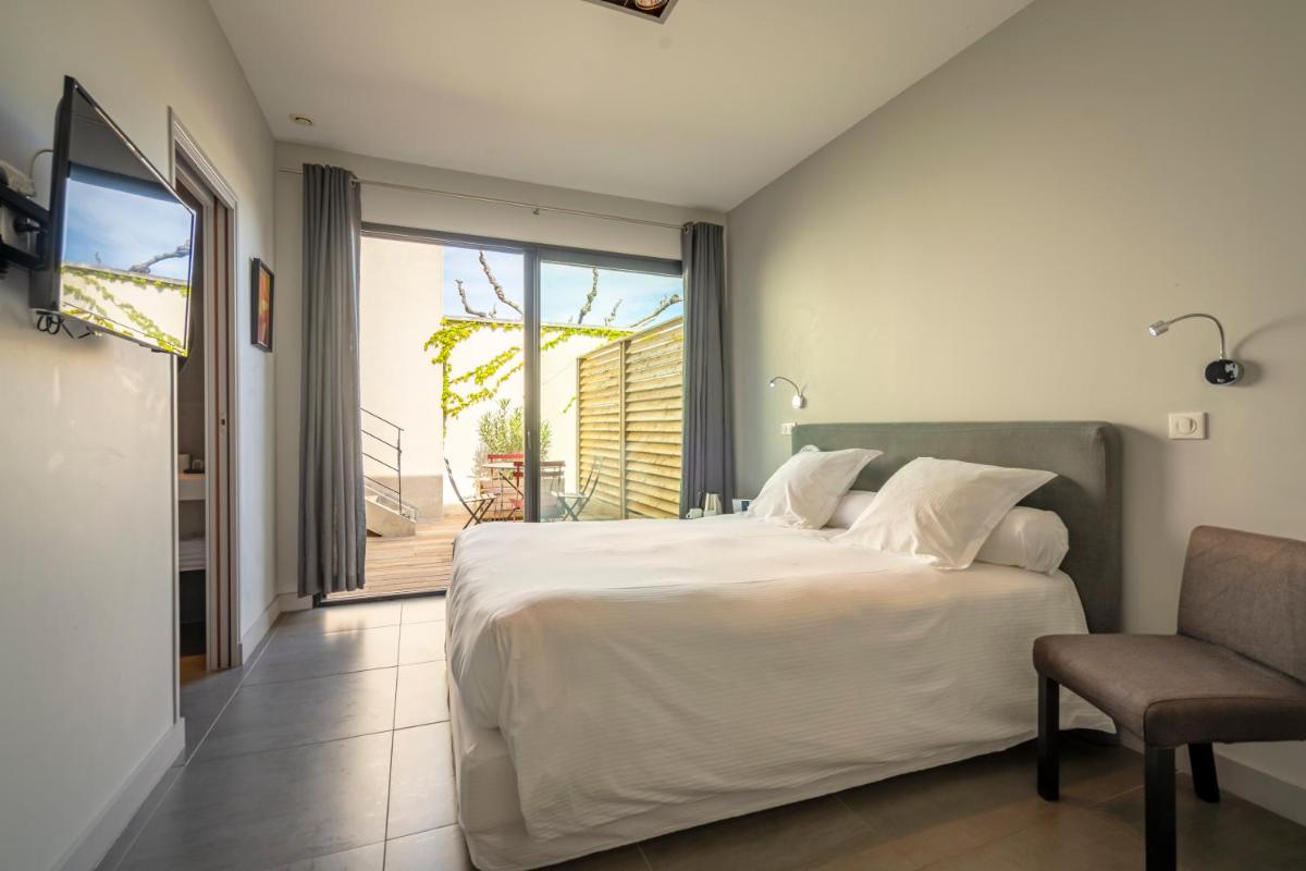 Un ou plusieurs lits dans un hébergement de l'établissement Lafitenia Resort