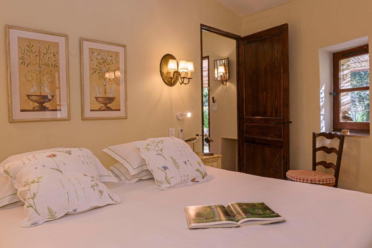 Un ou plusieurs lits dans un hébergement de l'établissement La Bastide du Calalou Hotel & Spa, BW Signature Collection