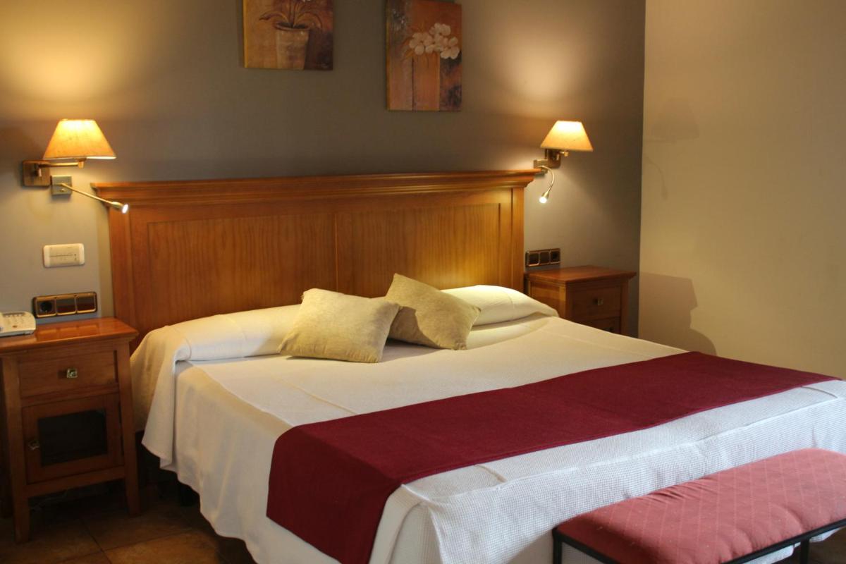 Cama o camas de una habitación en Hotel & SPA Peña Montañesa