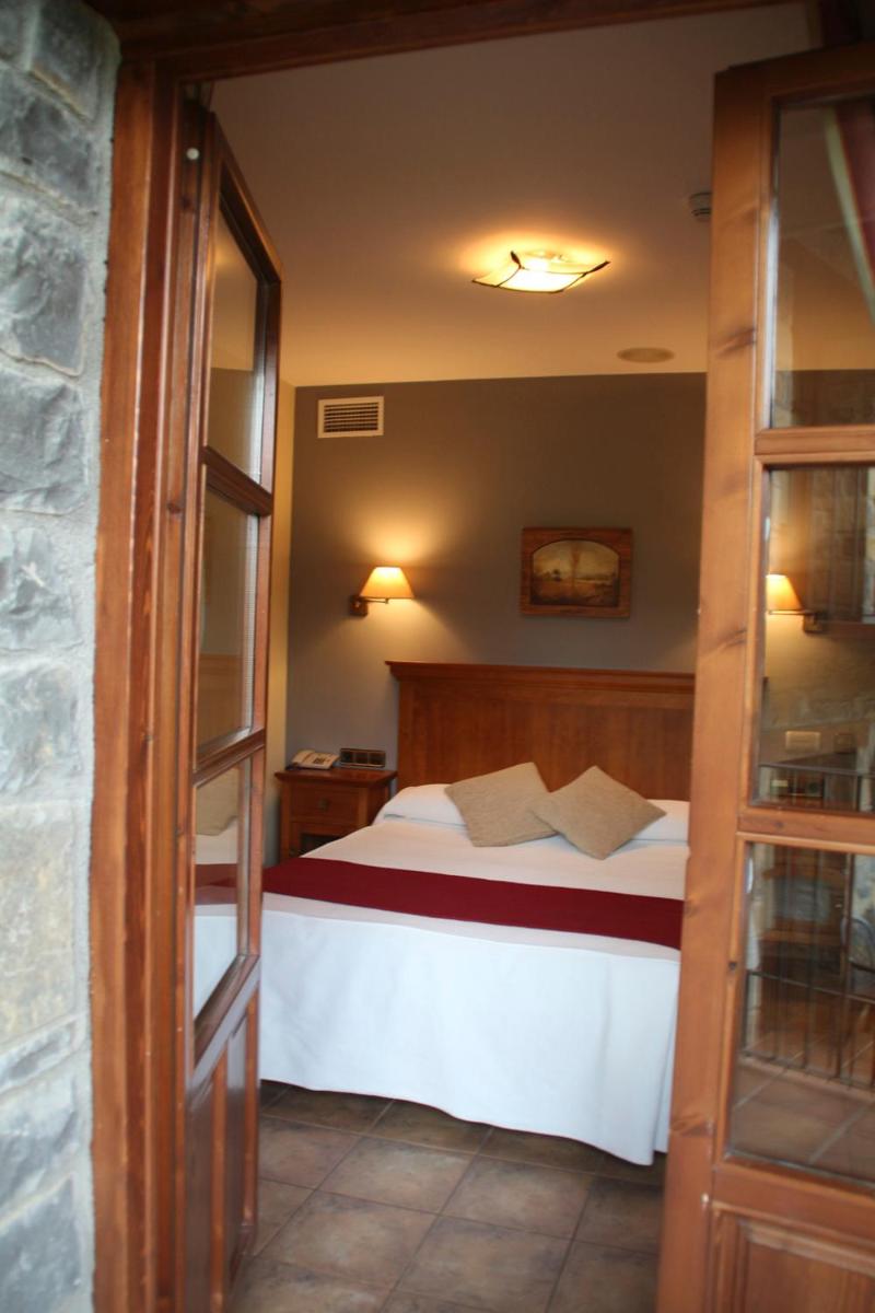 Cama o camas de una habitación en Hotel & SPA Peña Montañesa