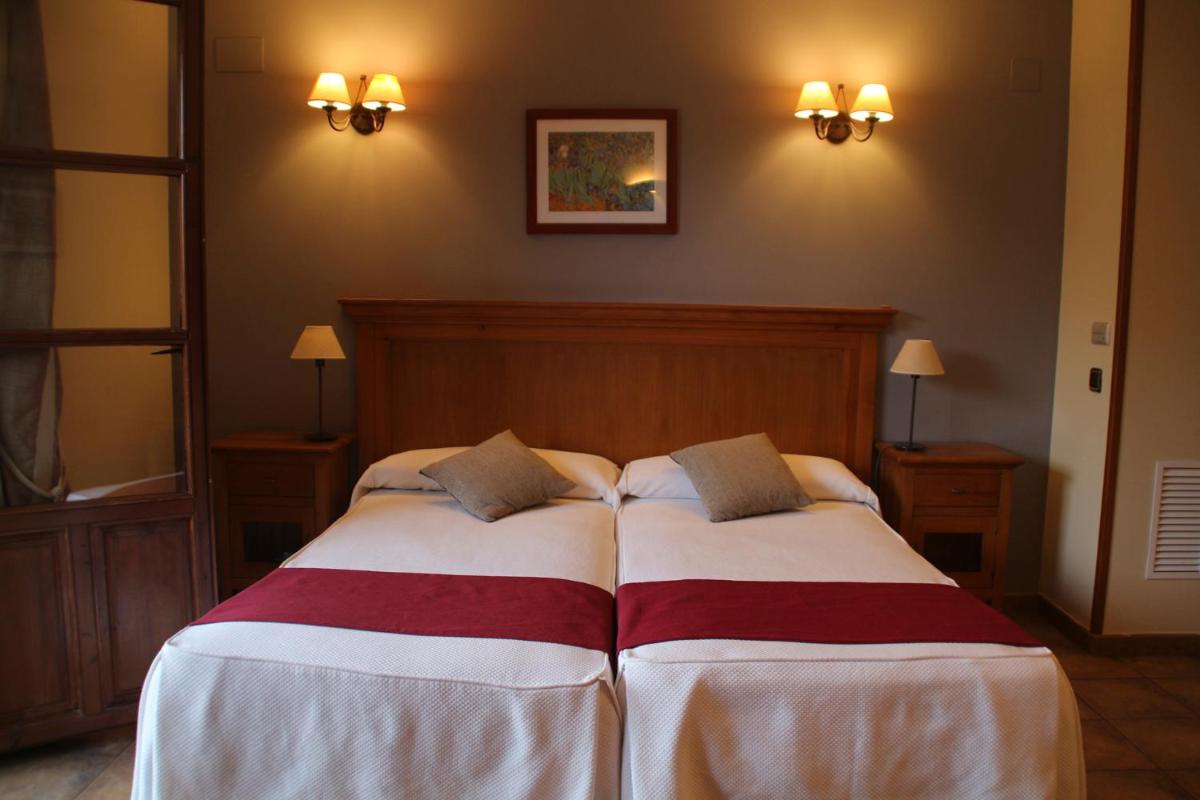 Cama o camas de una habitación en Hotel & SPA Peña Montañesa