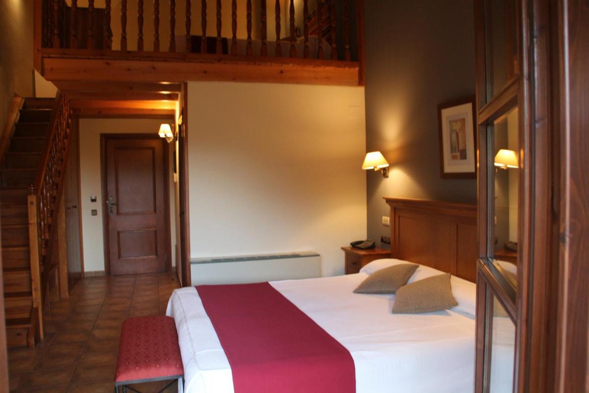 Cama o camas de una habitación en Hotel & SPA Peña Montañesa