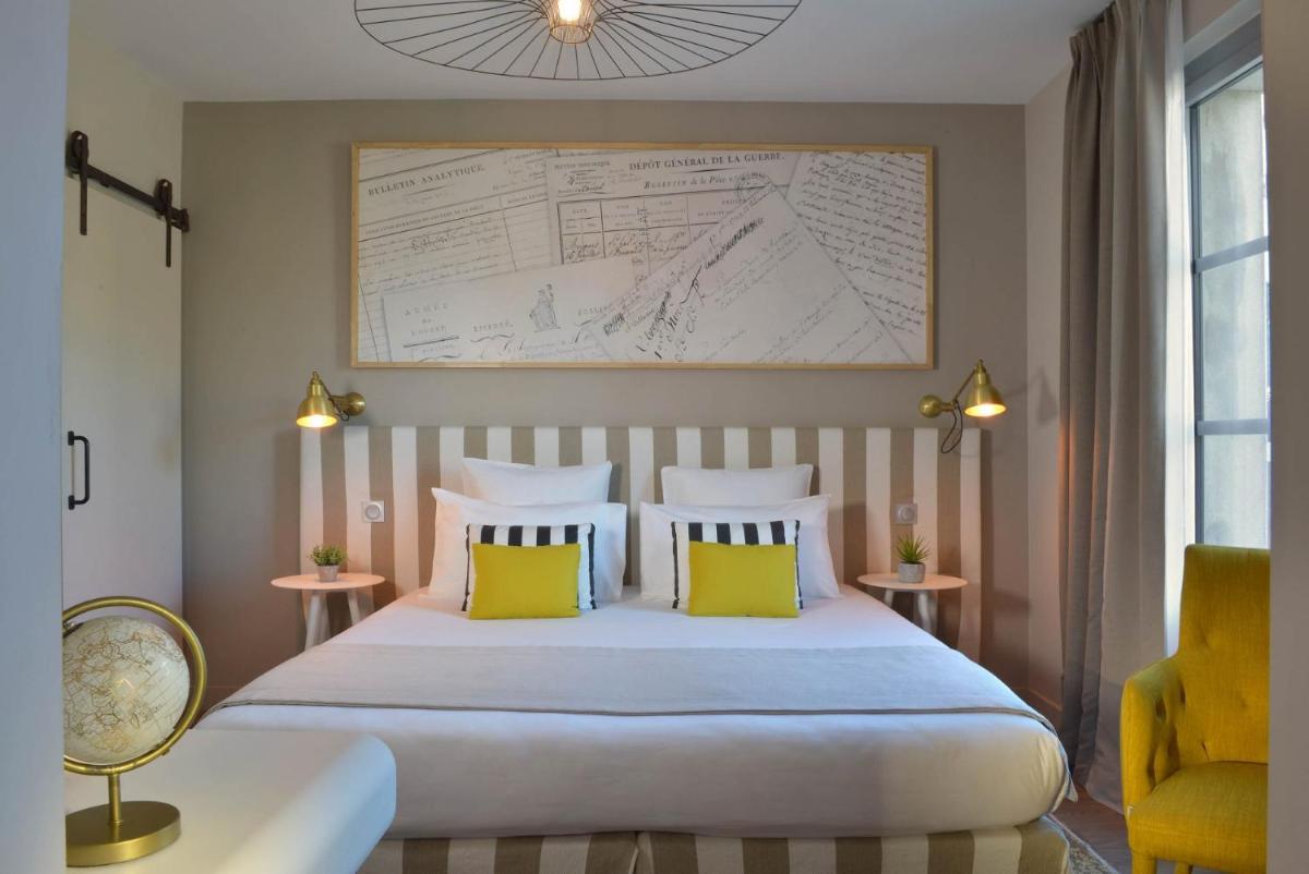 Un ou plusieurs lits dans un hébergement de l'établissement Le Général d'Elbée Hotel & Spa - Teritoria