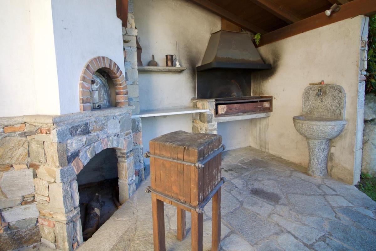 Oasi di Castelveccana Apt Pool and View - Happy Rentals - Housity