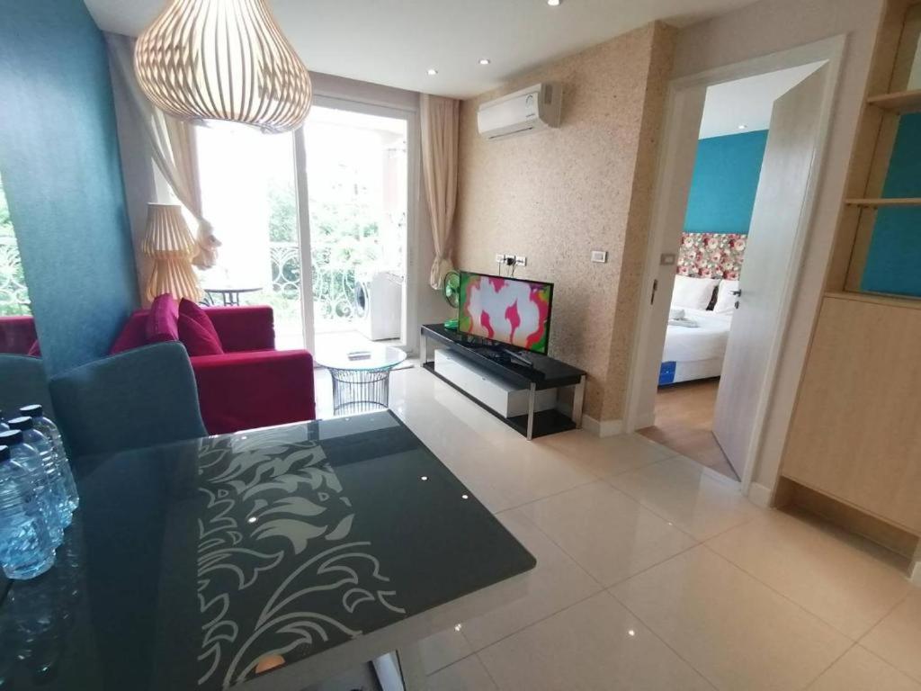 Grande Caribbean Condo by Somphong - Housity