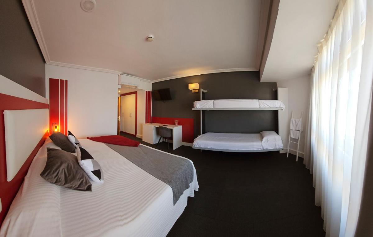 Cama o camas de una habitación en Hotel Spa El Muelle de Suances