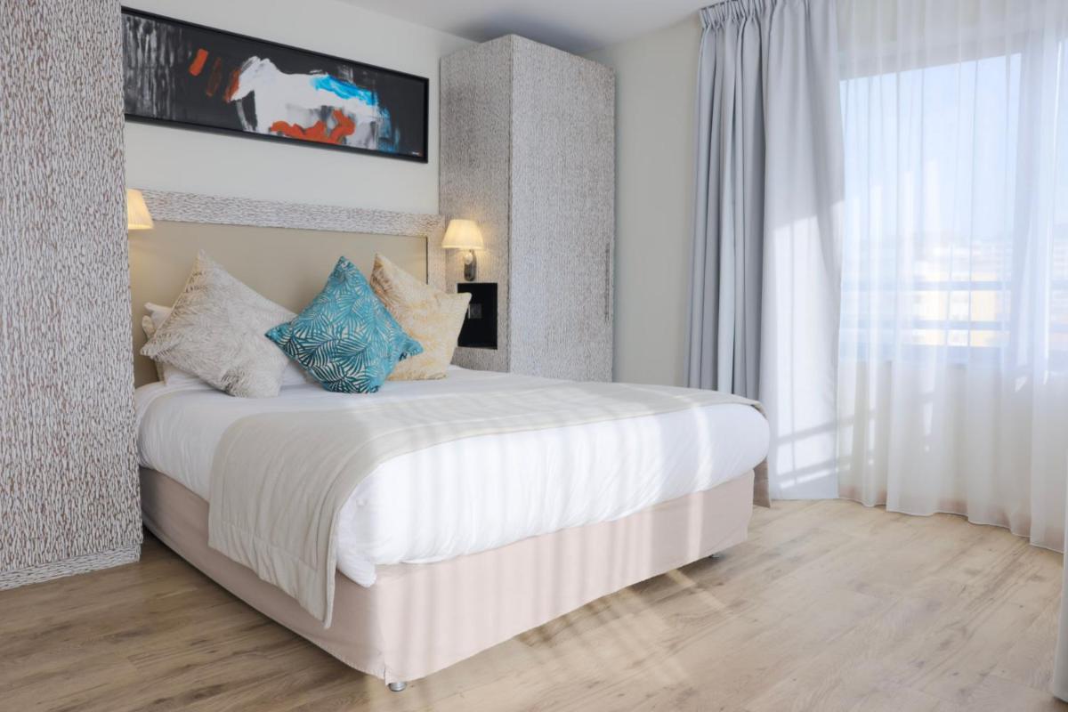 Un ou plusieurs lits dans un hébergement de l'établissement Eden Hotel & Spa