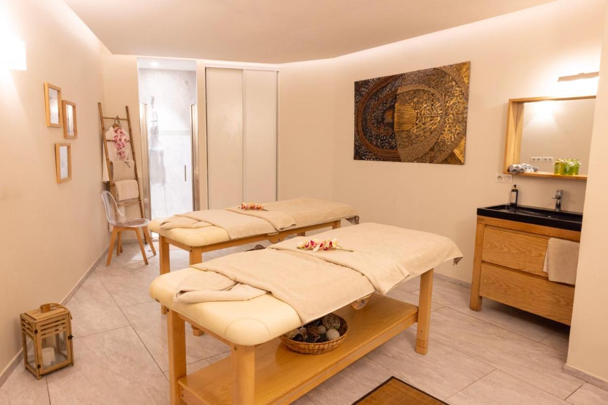 Un ou plusieurs lits dans un hébergement de l'établissement Eden Hotel & Spa