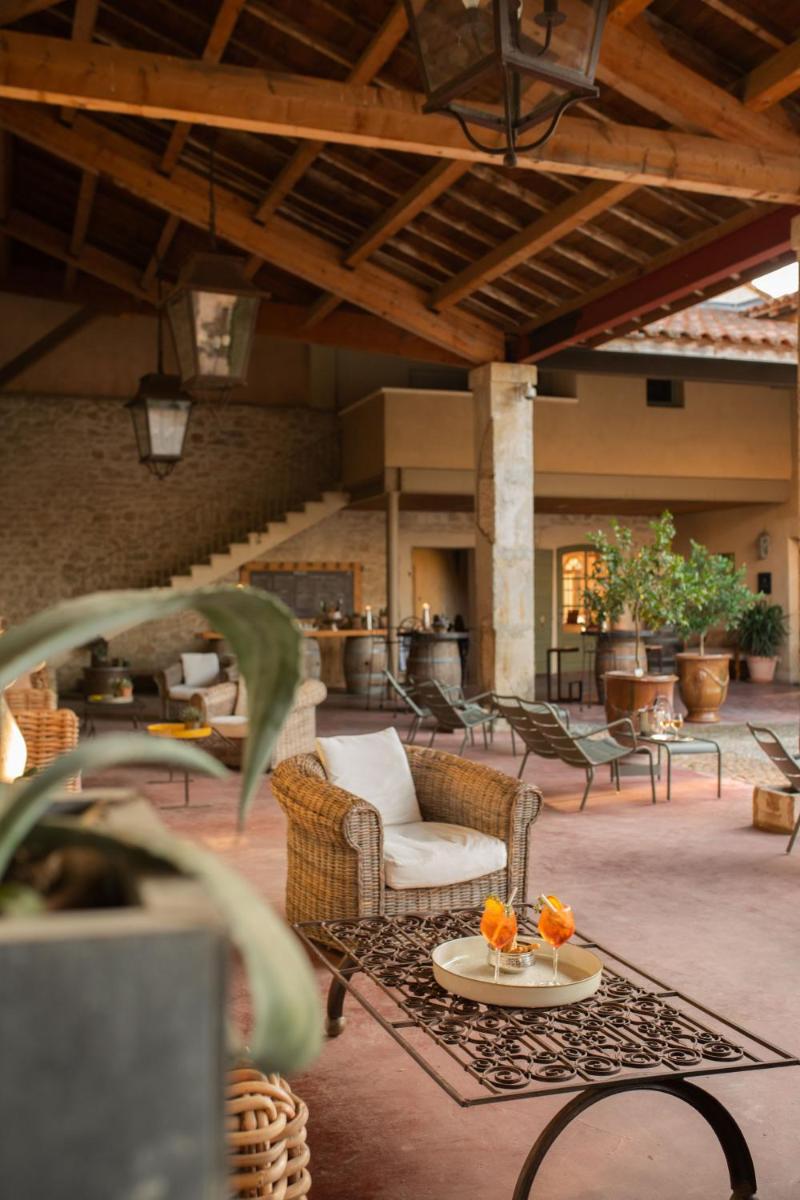 Coin salon dans l'établissement HOTEL et APPARTEMENTS DOMAINE DES CLOS - Teritoria