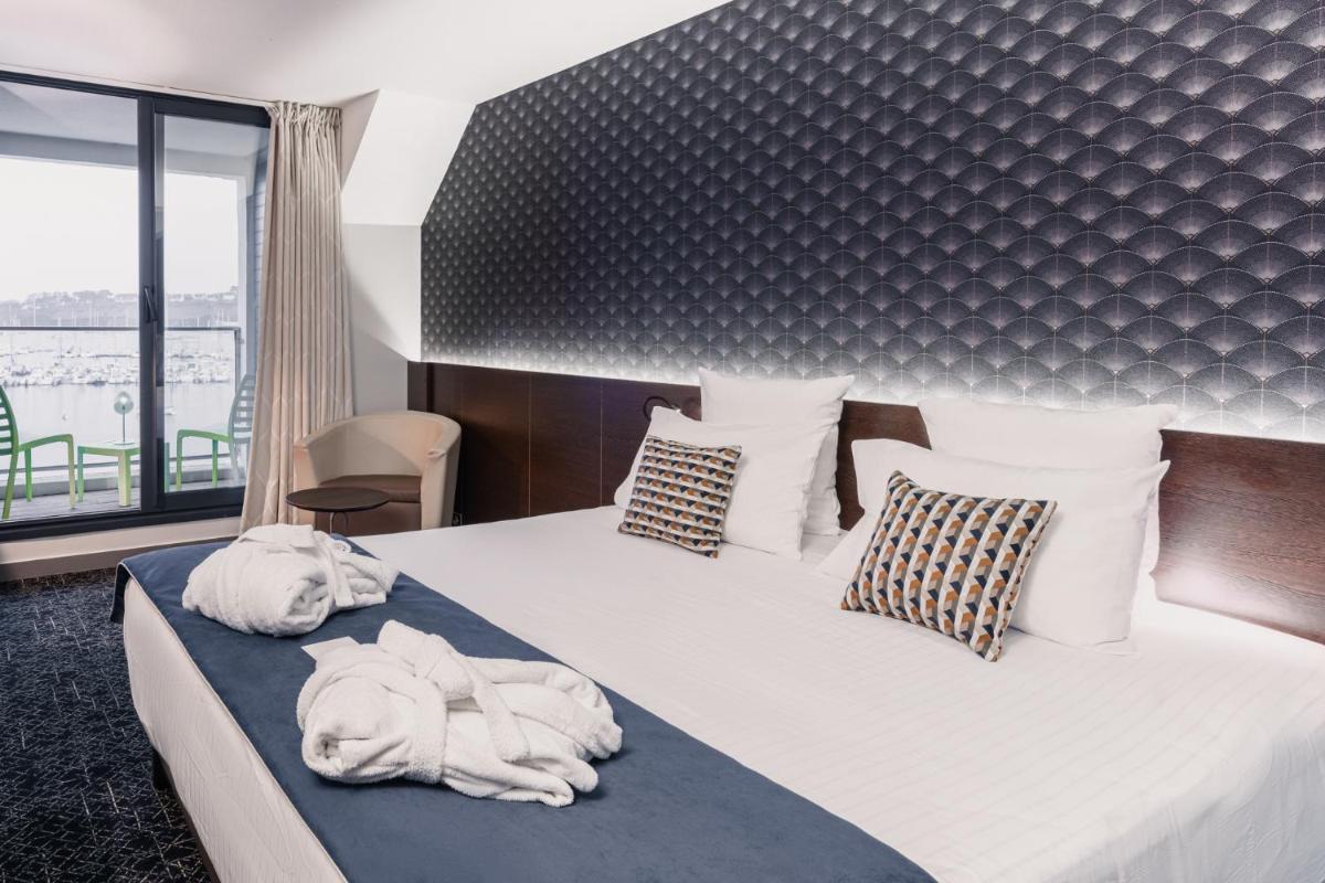 Un ou plusieurs lits dans un hébergement de l'établissement Le Thalassa Hôtel & Spa