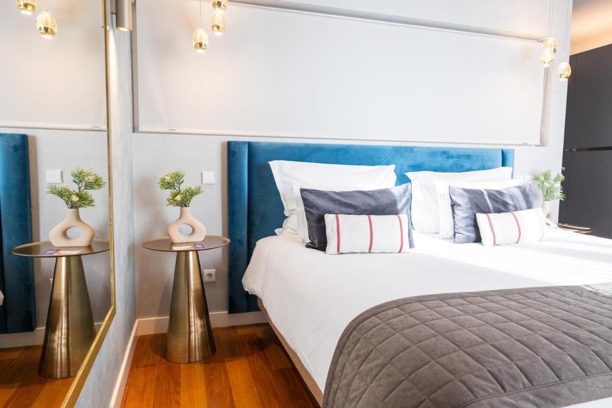 Uma cama ou camas num quarto em Pestana Cidadela Cascais - Pousada & Art District