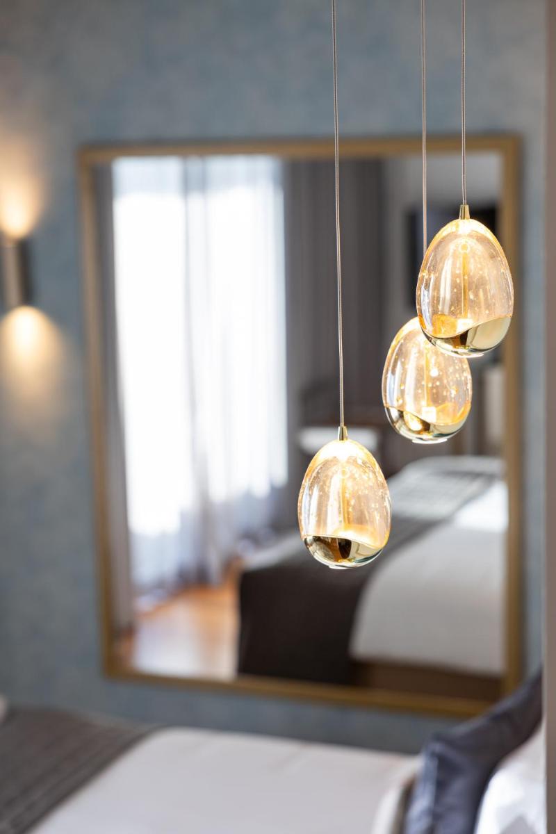 Uma cama ou camas num quarto em Pestana Cidadela Cascais - Pousada & Art District