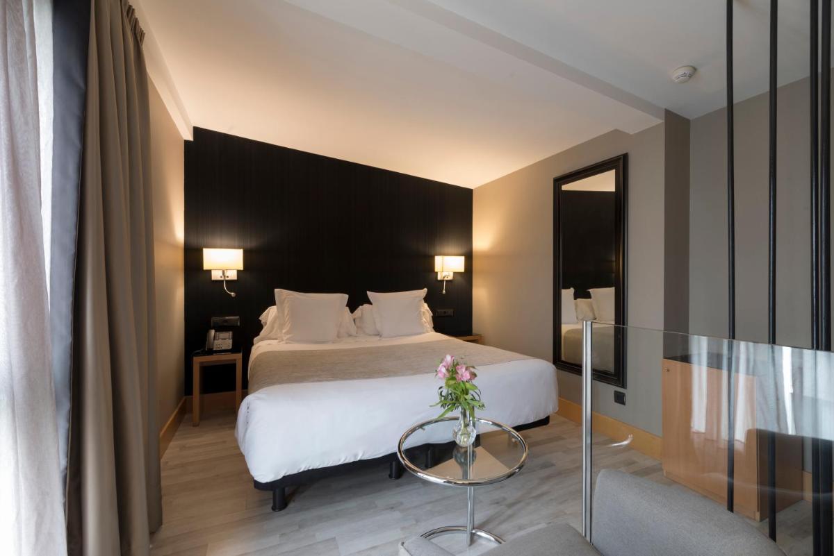 Cama o camas de una habitación en Hotel Plaza
