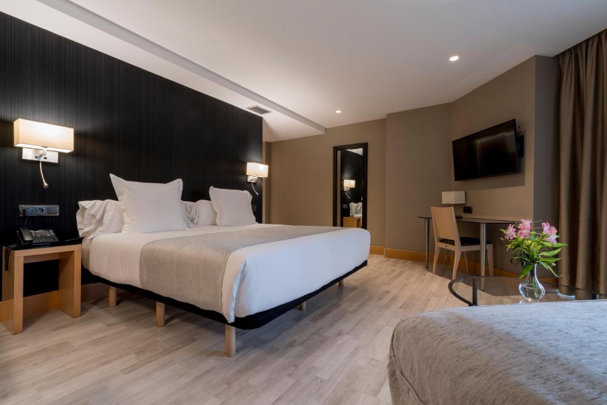 Cama o camas de una habitación en Hotel Plaza
