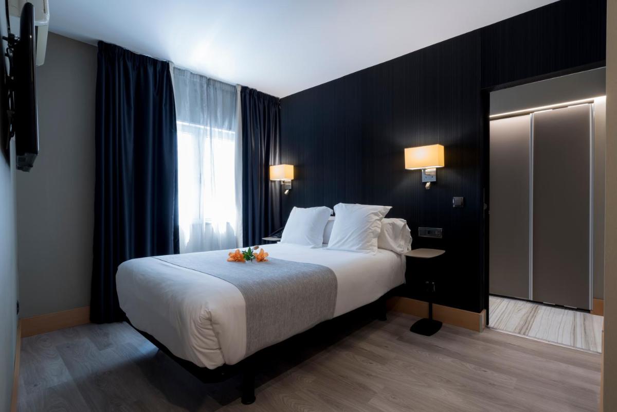 Cama o camas de una habitación en Hotel Plaza